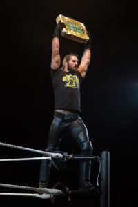 Seth_Rollins_holds_Money_in_the_Bank_briefcase_at_a_WWE_house_show_in_January_2015